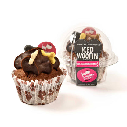 A packaged Carob woofin cake with carob frosting, designed for dogs, displayed alongside its protective pod.